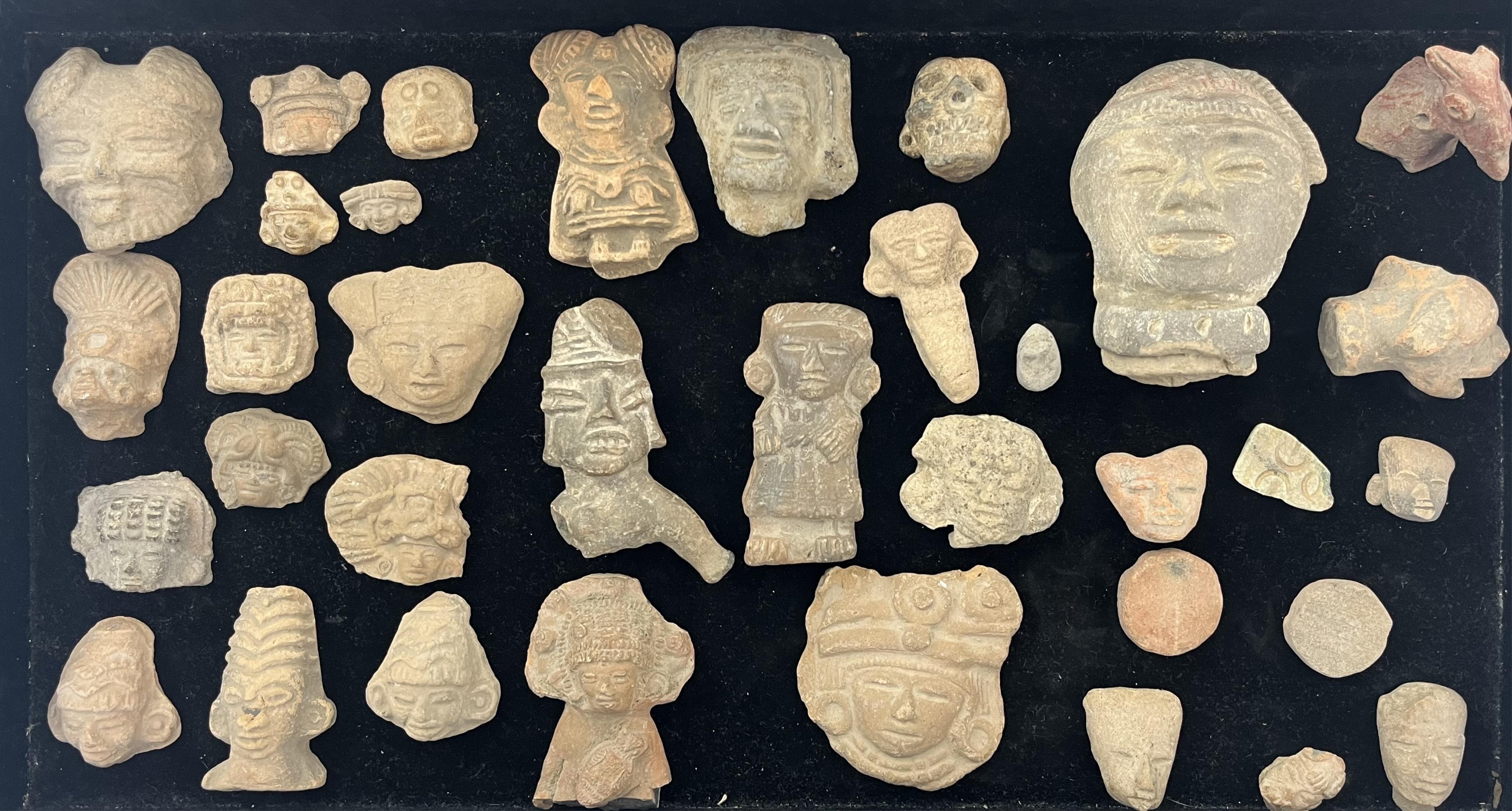 A large group of Pre-Columbian Aztec terracotta heads and figures, Mexico, 200 BC - AD 250